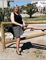 By A Busy Road In Nude Pantyhose And Skirt Around The Waist